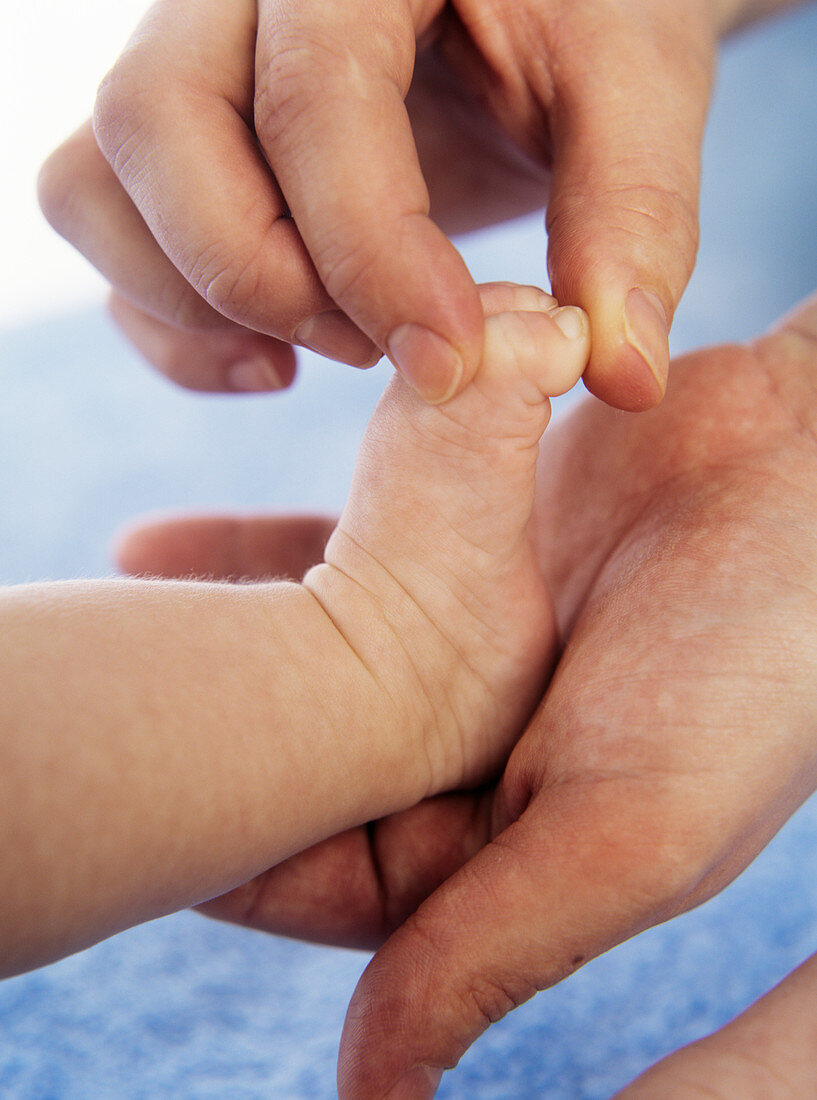 Massaging baby toes