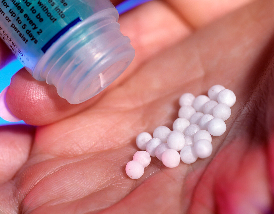 Homeopathy pills in a hand