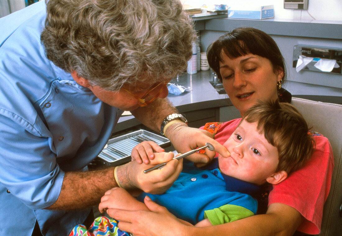 Child undergoing a dental examination