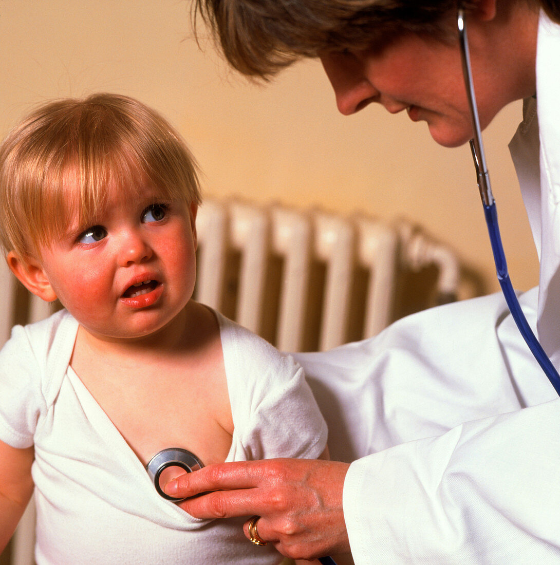 GP doctor examines child's chest with stethoscope