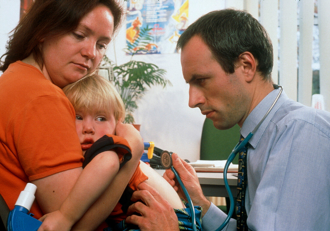 GP doctor examines child's chest with stethoscope