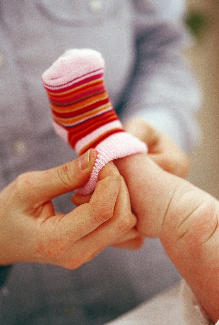 Baby being dressed