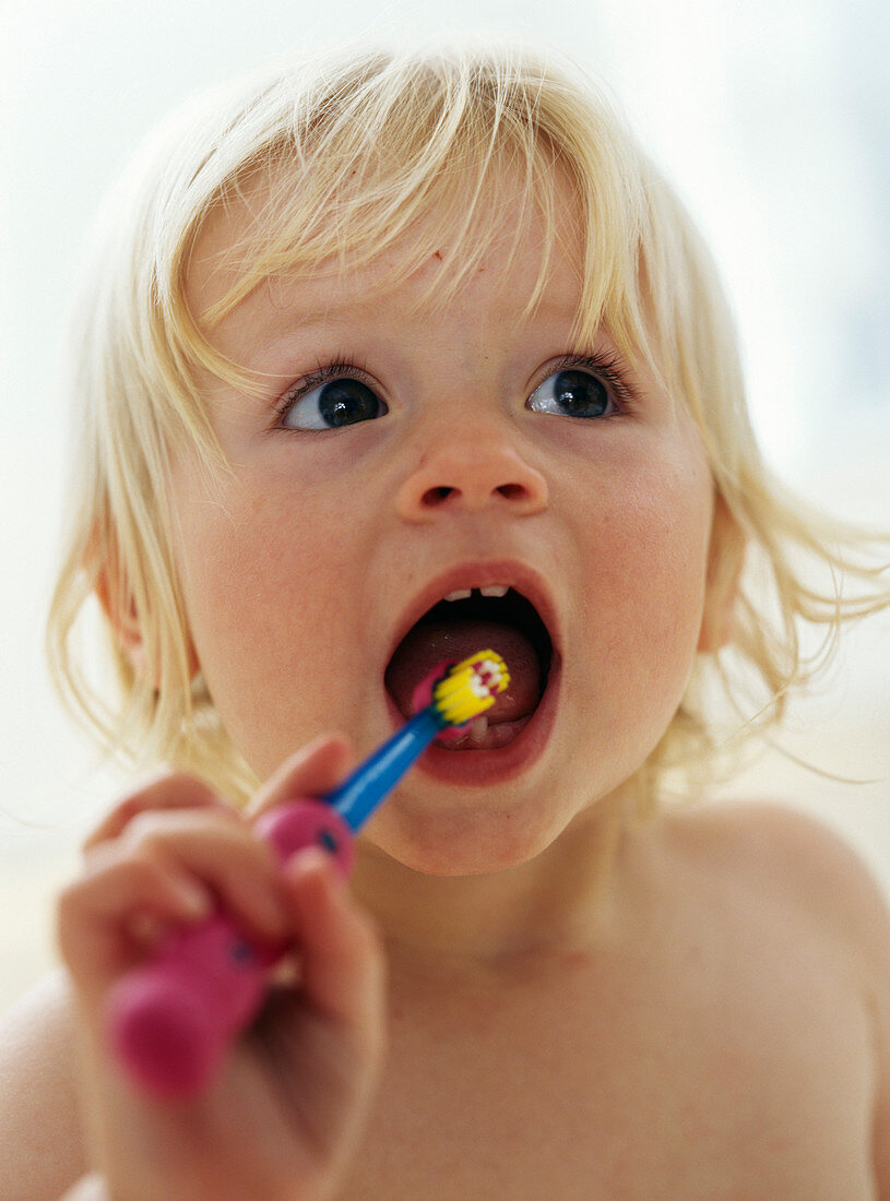 Baby girl brushing teeth