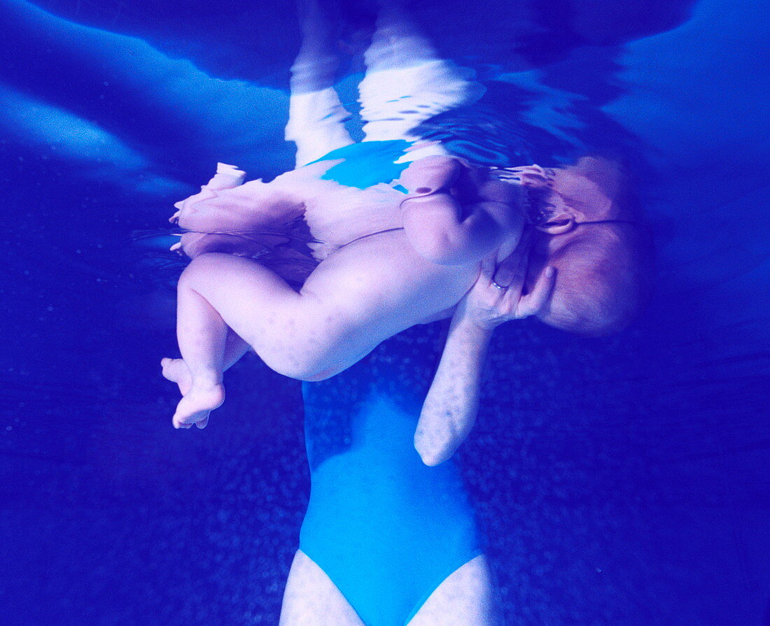 Mother and baby in a swimming pool