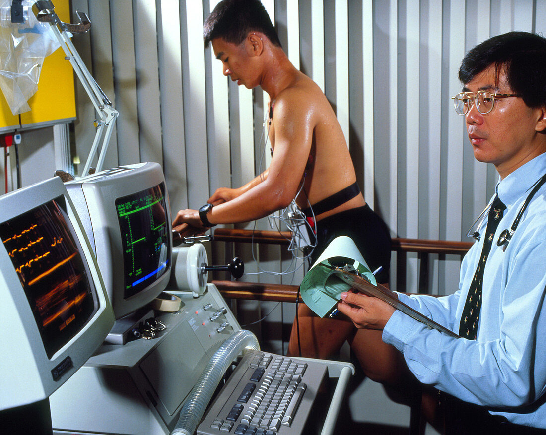 Man on treadmill with doctor and ECG machine