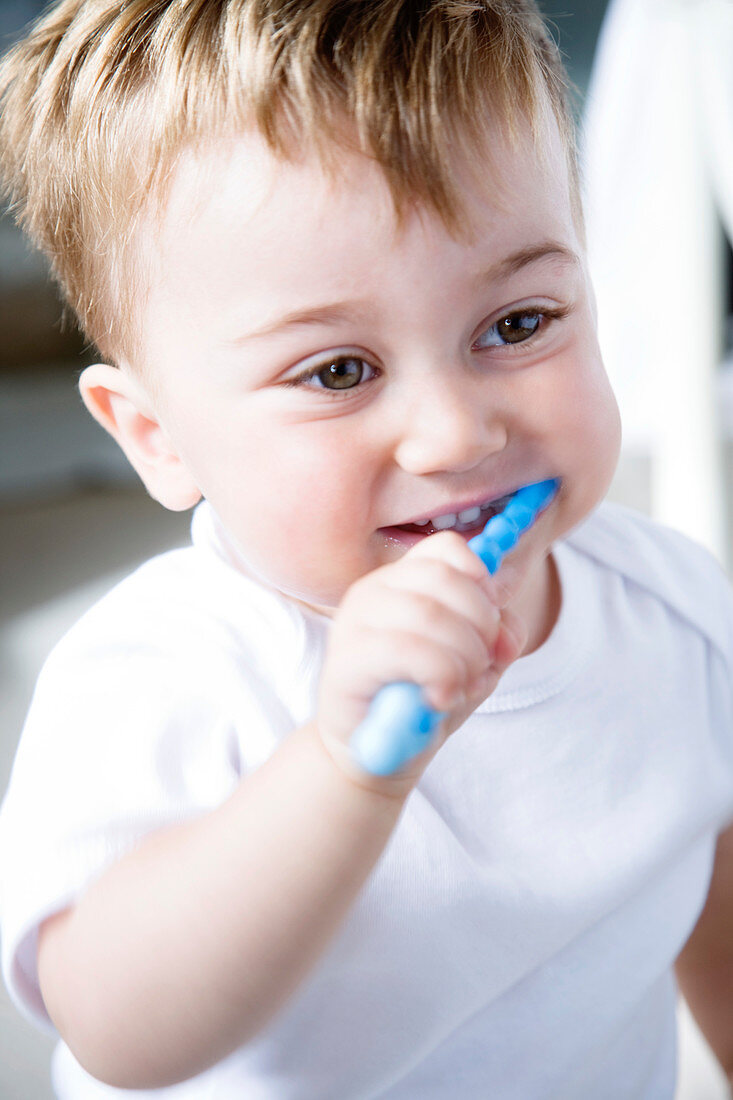 Young boy brushing his teeth