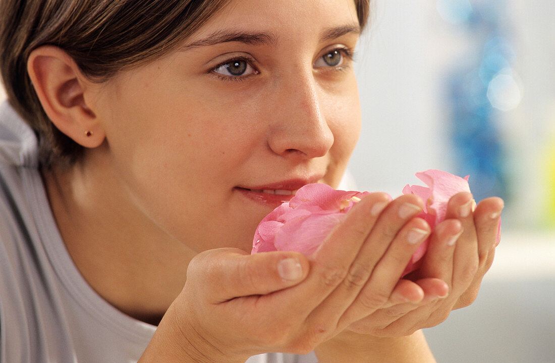 Smelling rose petals