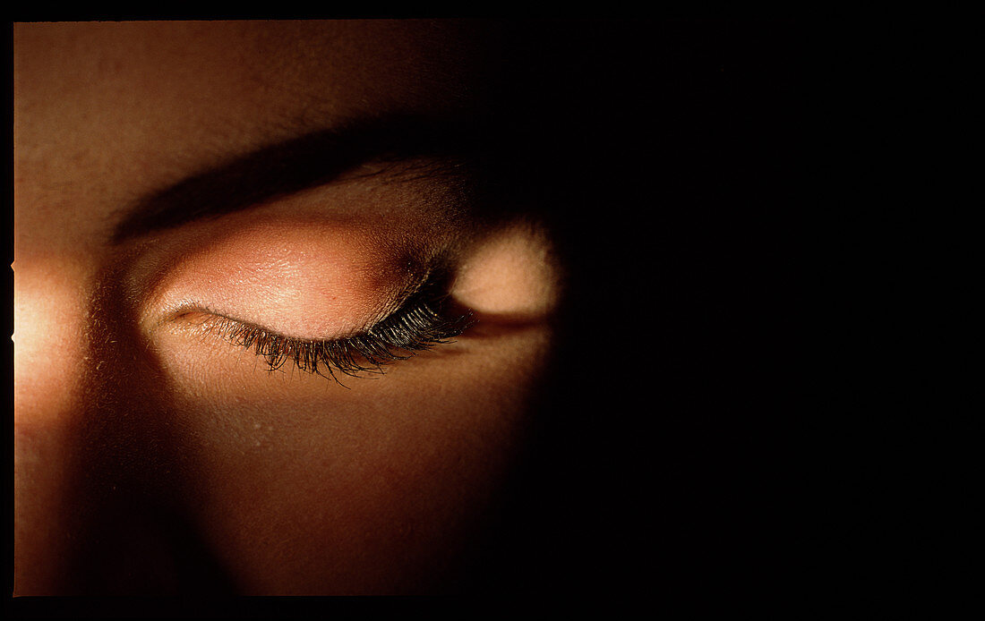 Closed woman's eye with mascara make-up