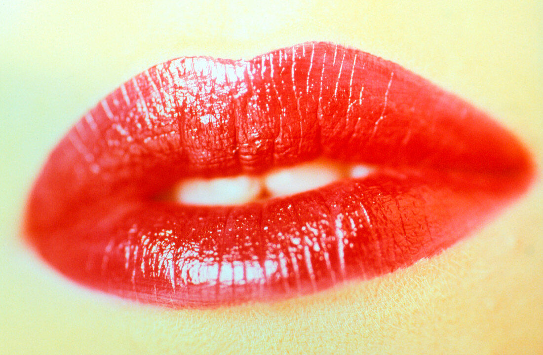 Close-up of the mouth of a woman wearing lipstick