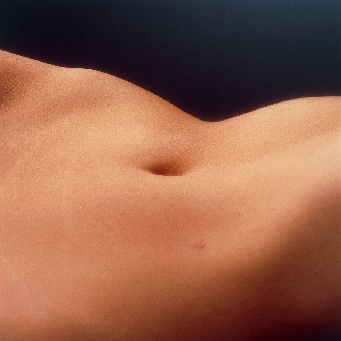 View of the abdomen of a woman lying down