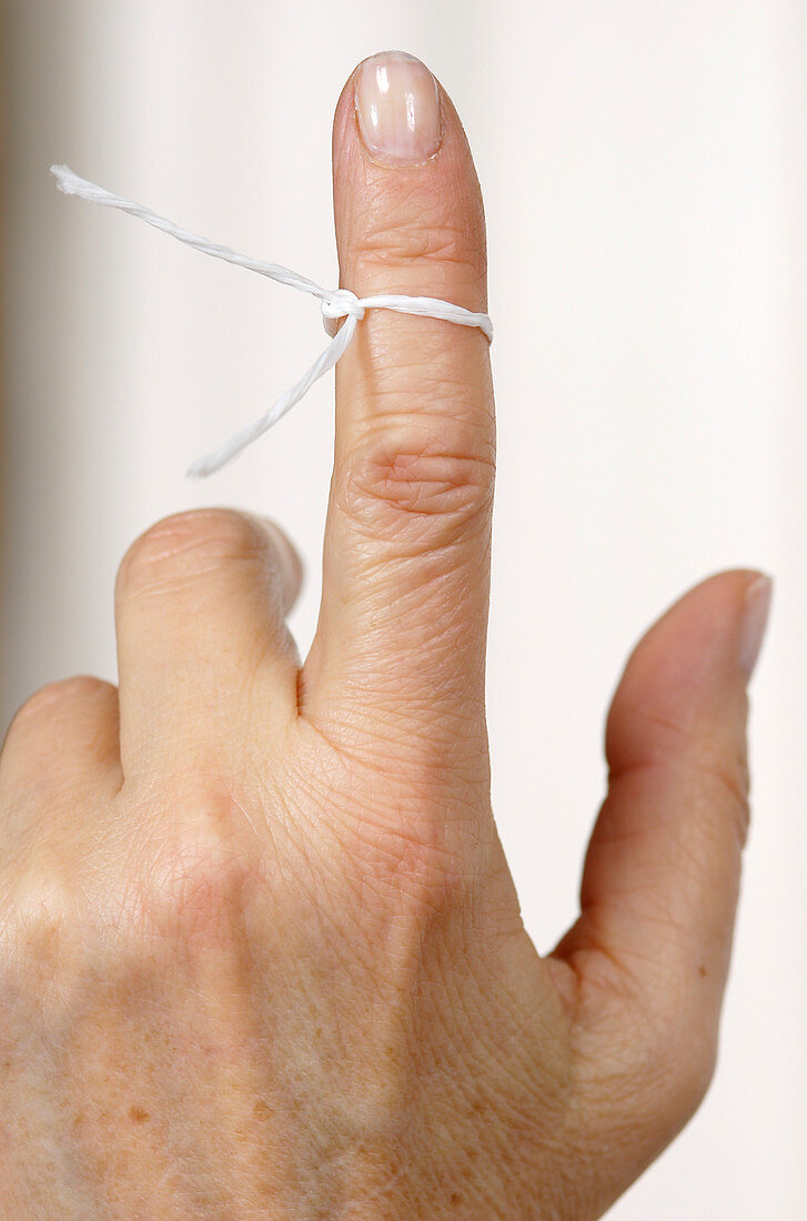 String tied around a finger