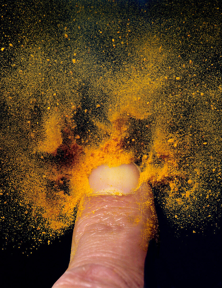 Powder blown from a fingernail