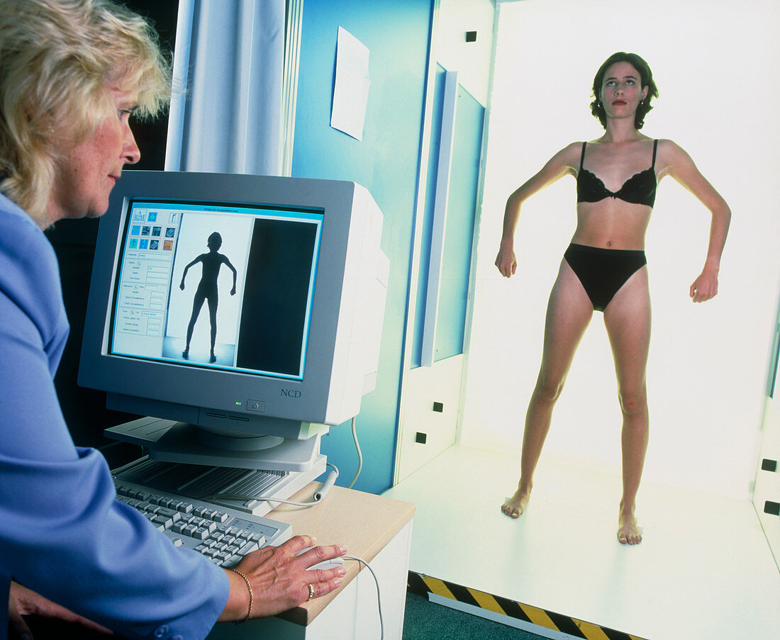 Computer measuring woman's body for fashion design