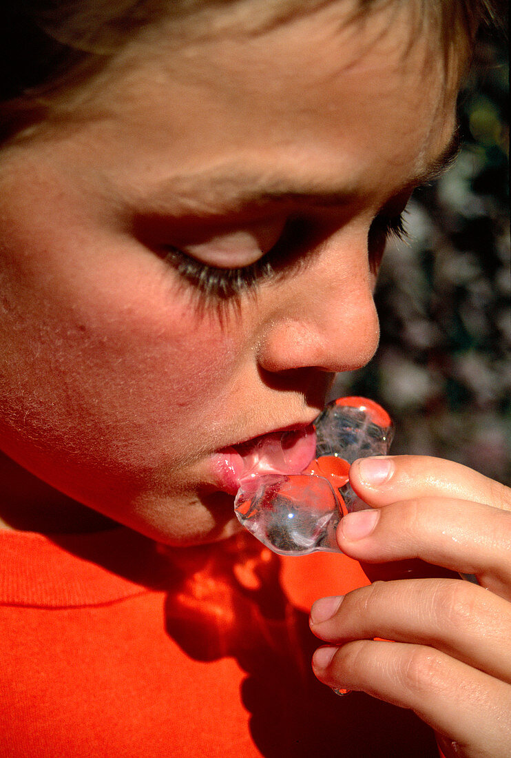 Boy eating an ice cube