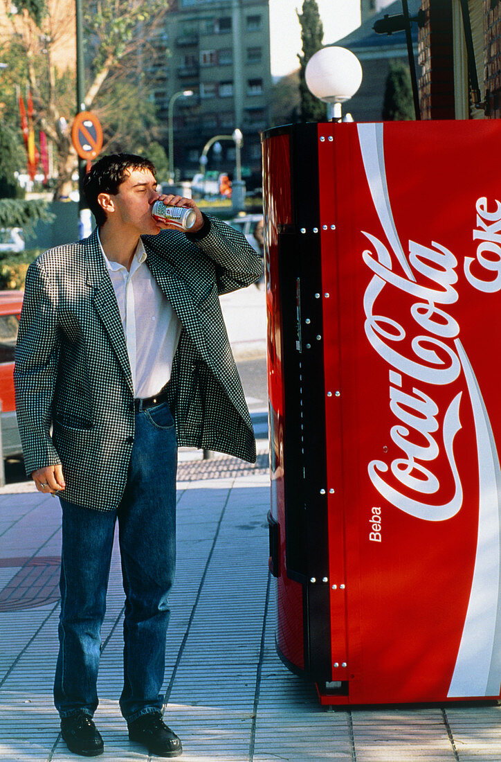 Man drinking a can of coke