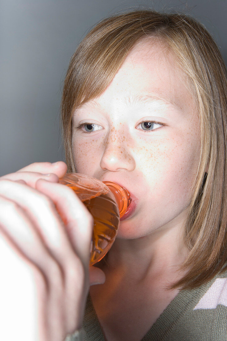 Girl drinking a fizzy drink