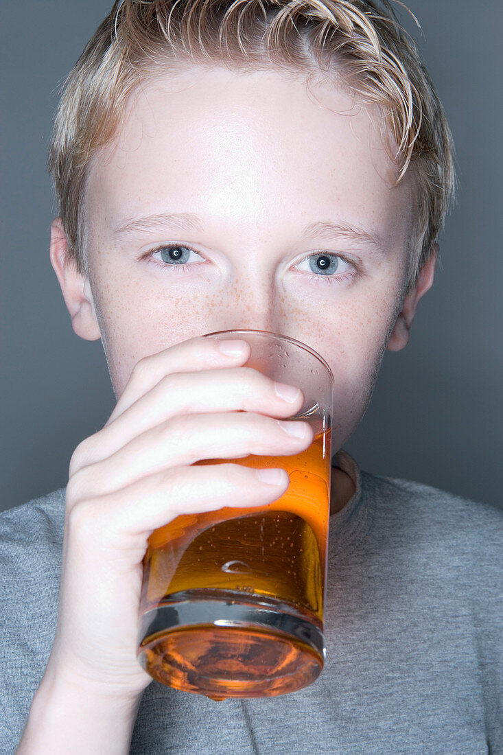 Boy drinking a fizzy drink
