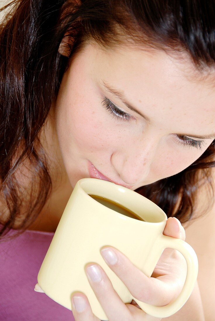 Woman drinking a hot drink