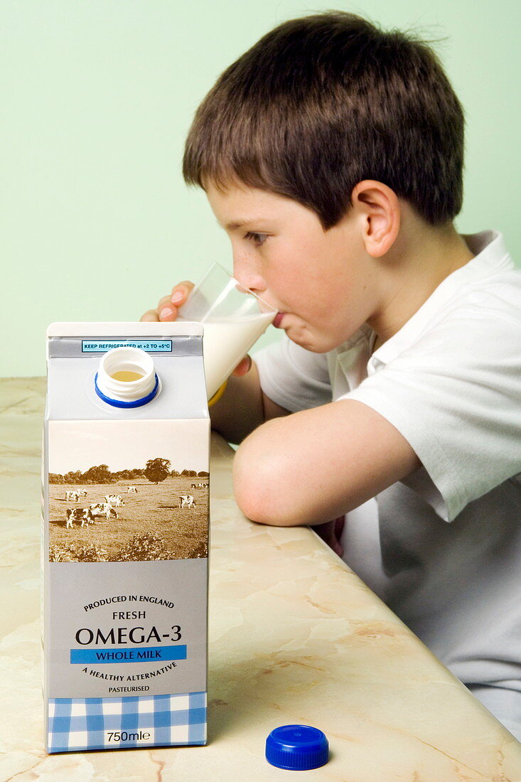Boy drinking omega-3 fish oil milk