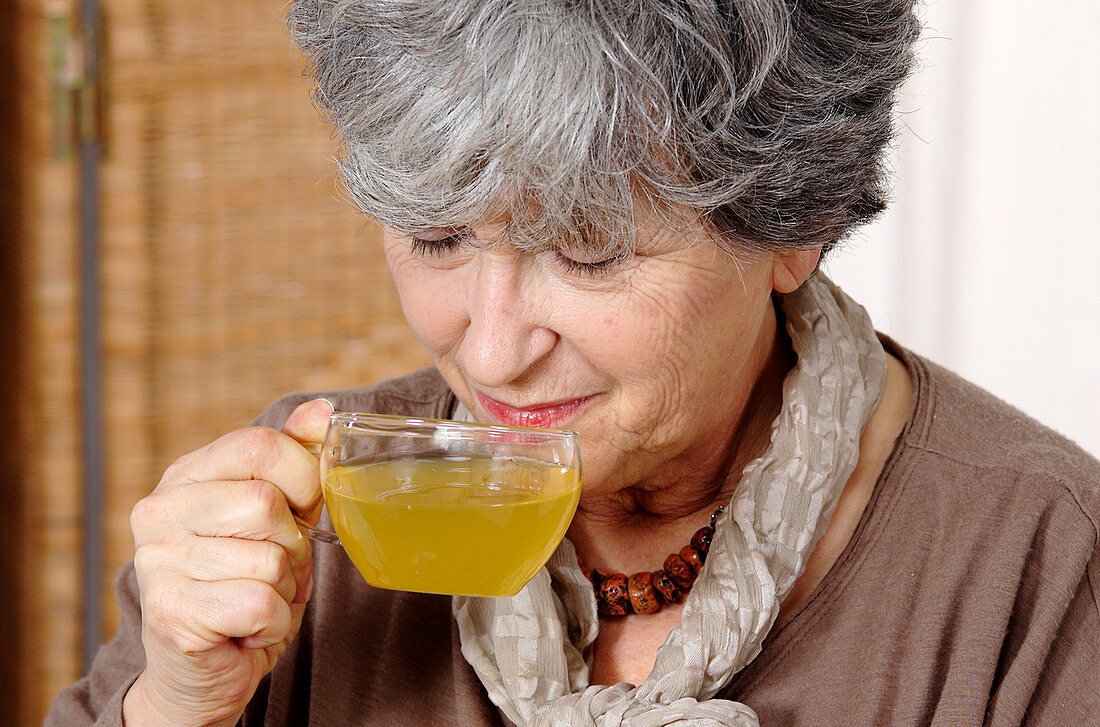 Woman drinking herb tea