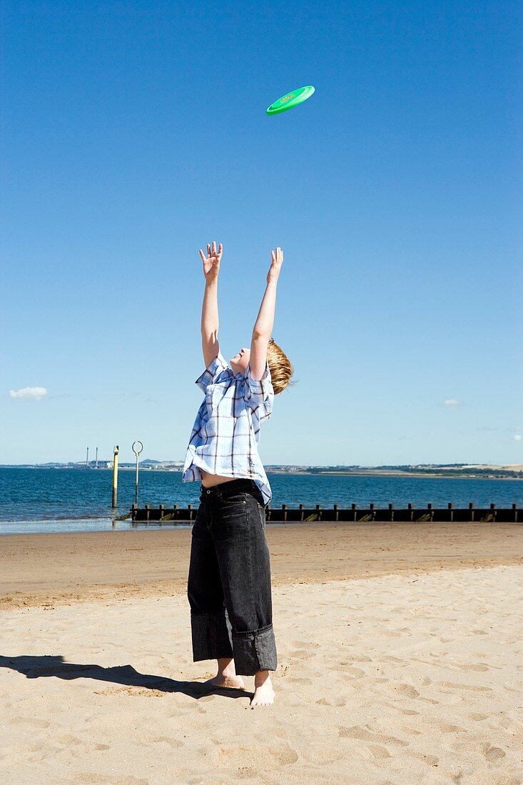 Boy catching a frisbee