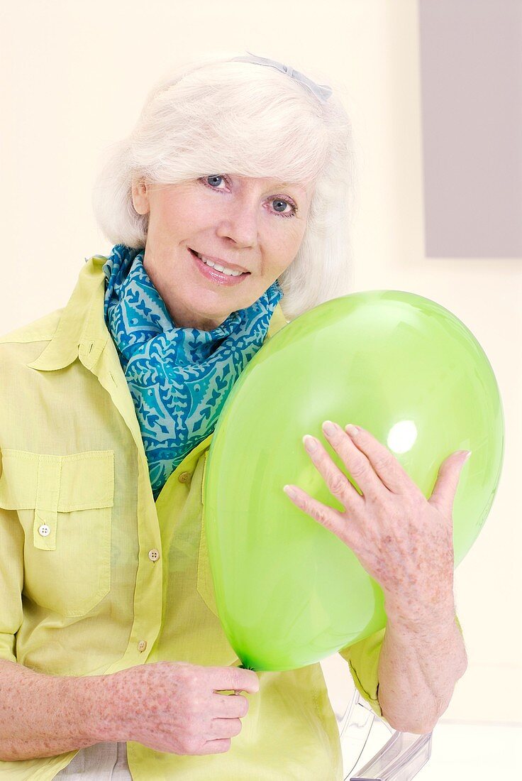 Woman holding a balloon