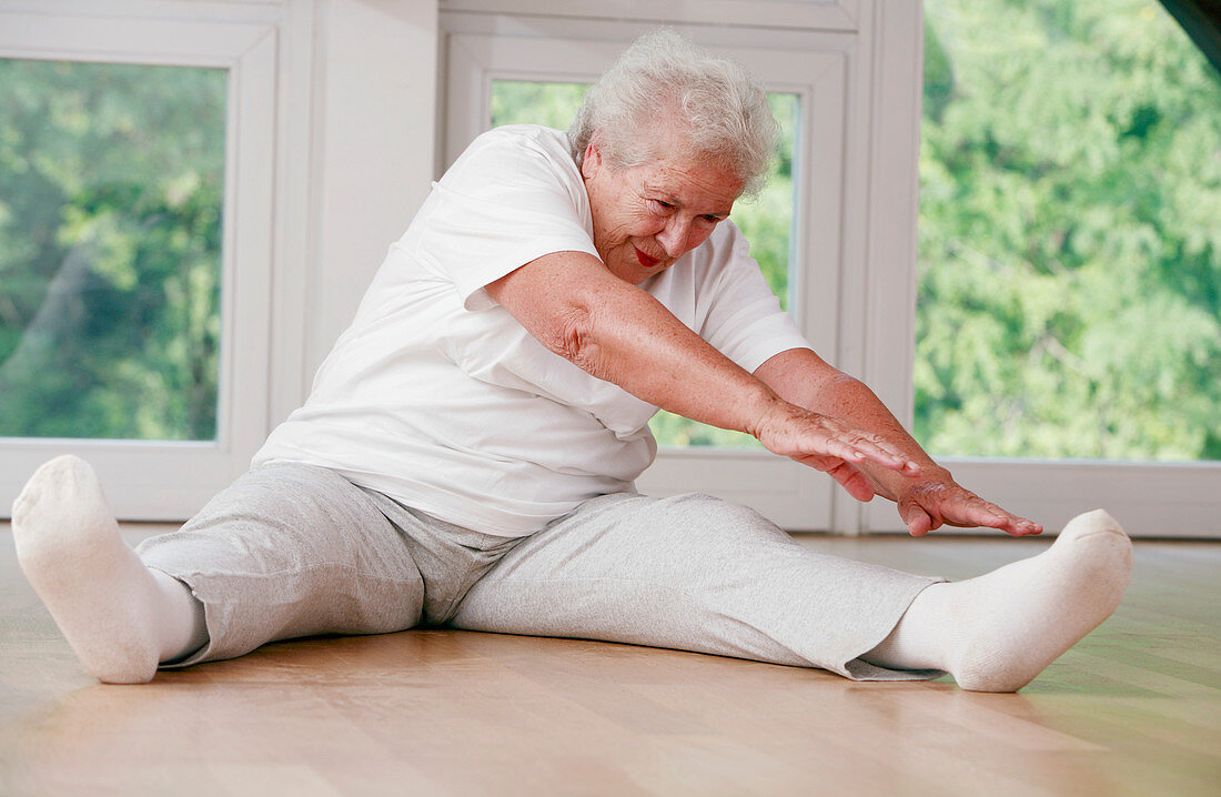 Elderly woman stretching