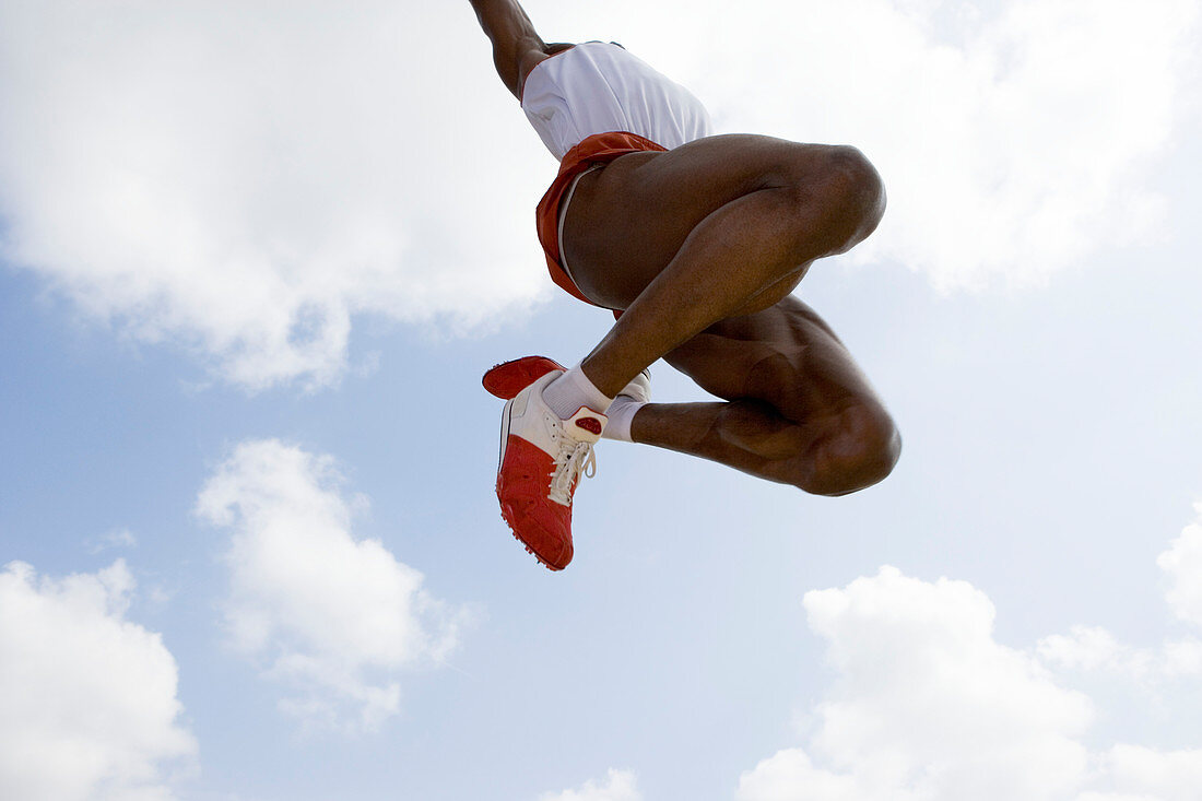 Athlete performing a long jump