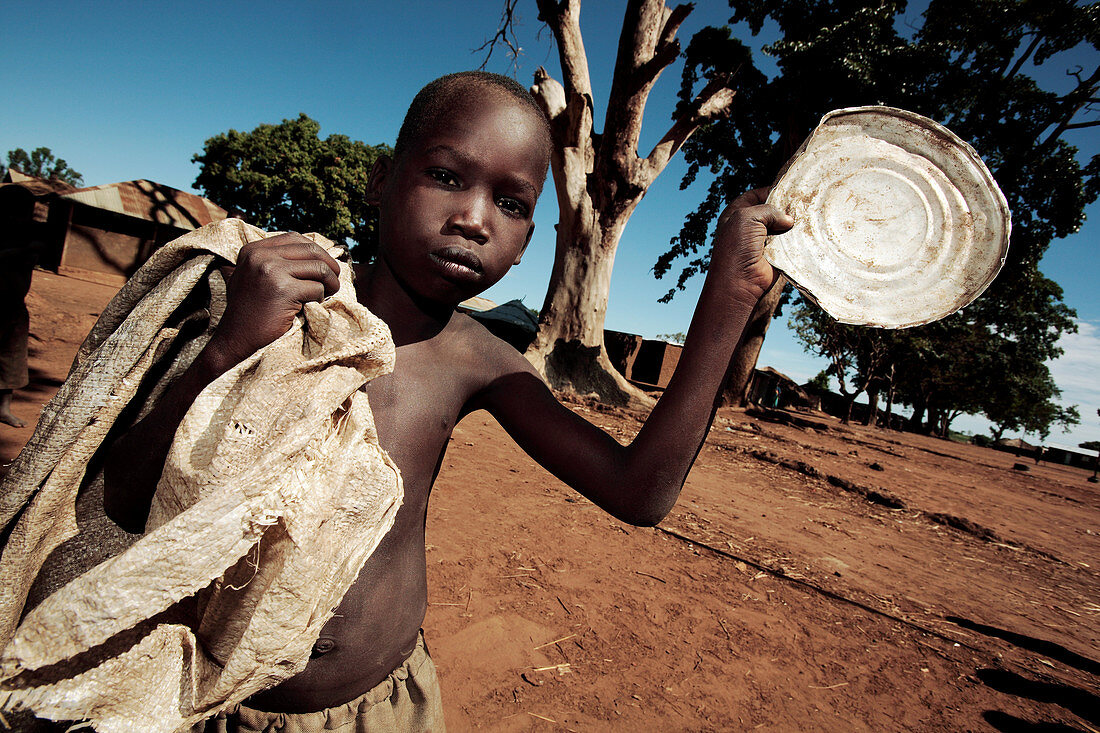 Boy collecting scrap metal,Uganda