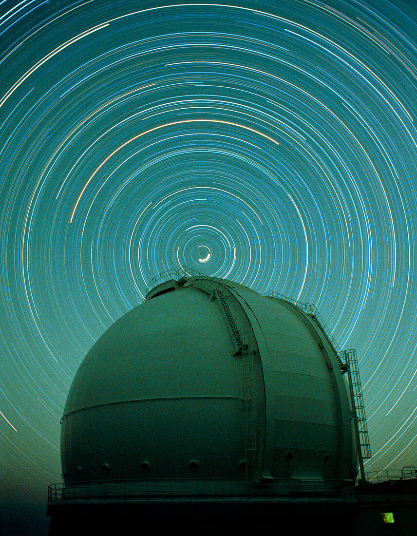 Time exposure of star trails over dome