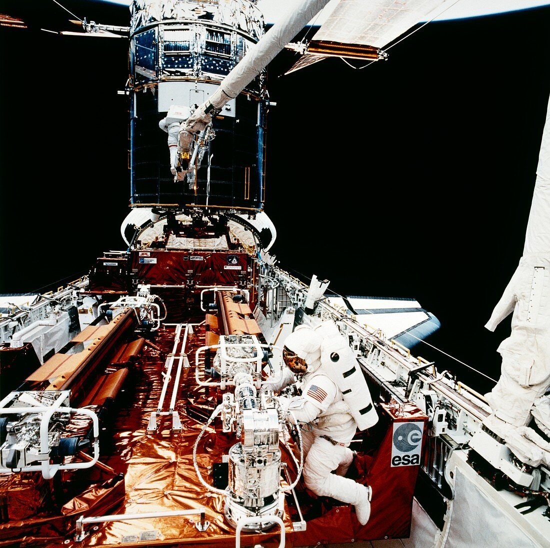Astronauts seen during HST servicing,STS-61
