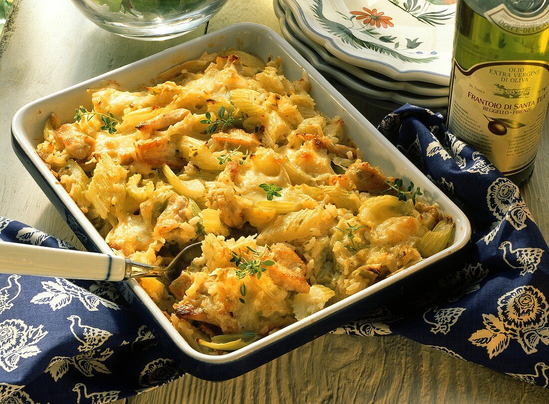 Rice bake with celery and turkey in casserole dish