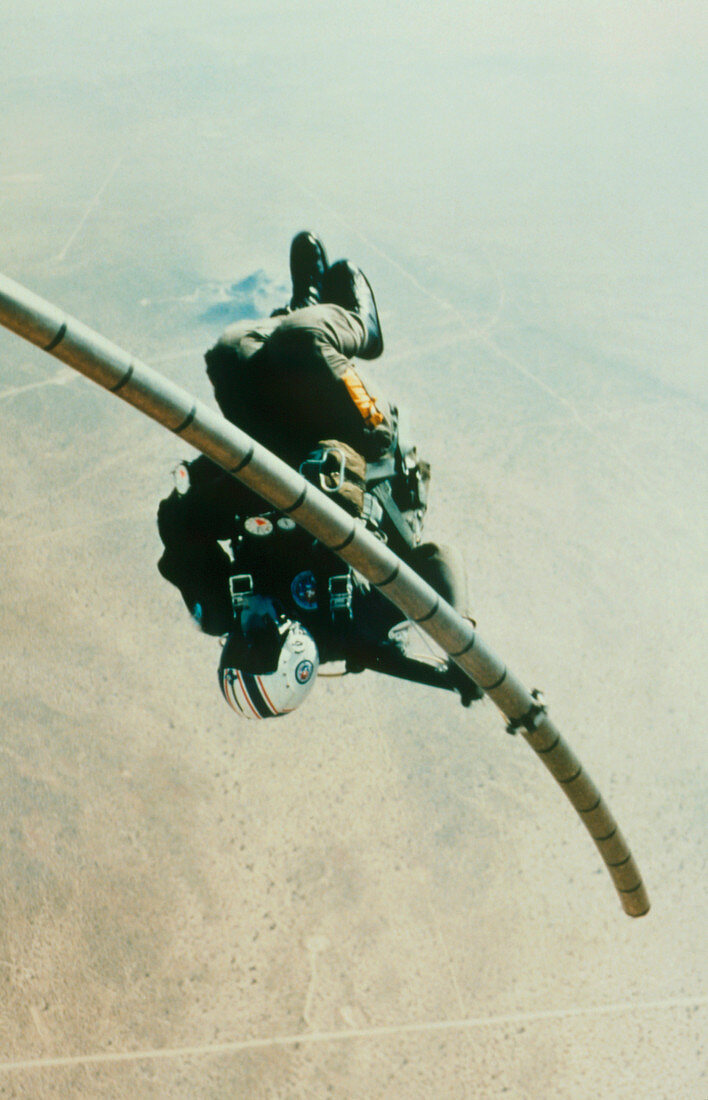 Navy parachutist slides down telescopic pole
