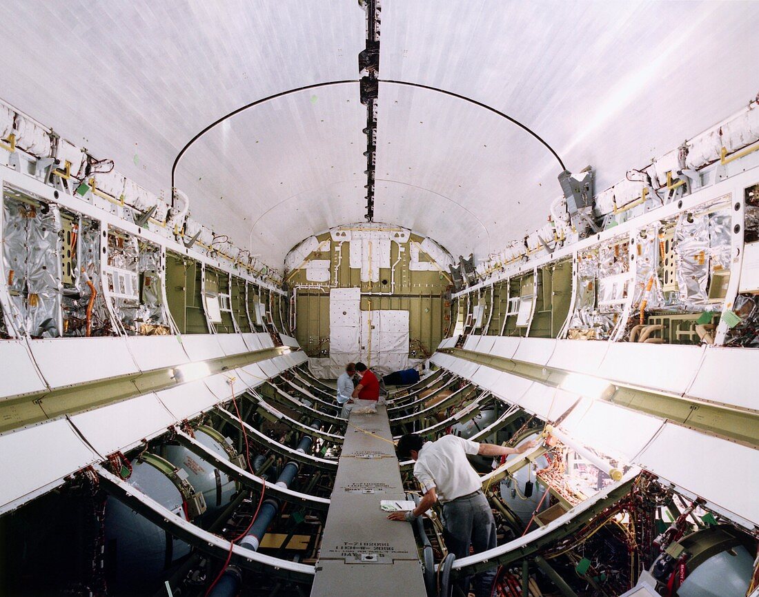 Workers in payload bay of Shuttle Endeavour