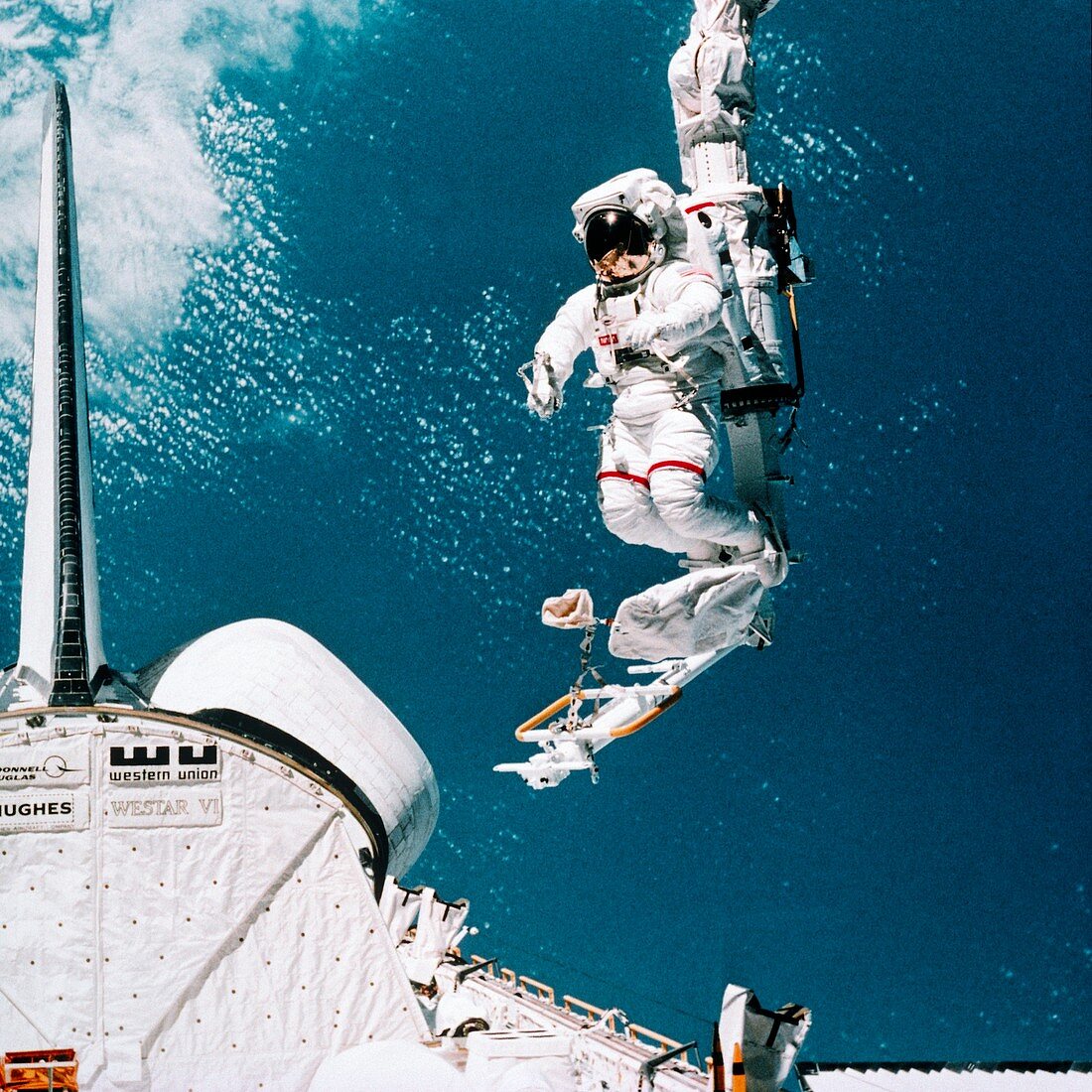 Space shuttle astronaut in MMU spacewalk