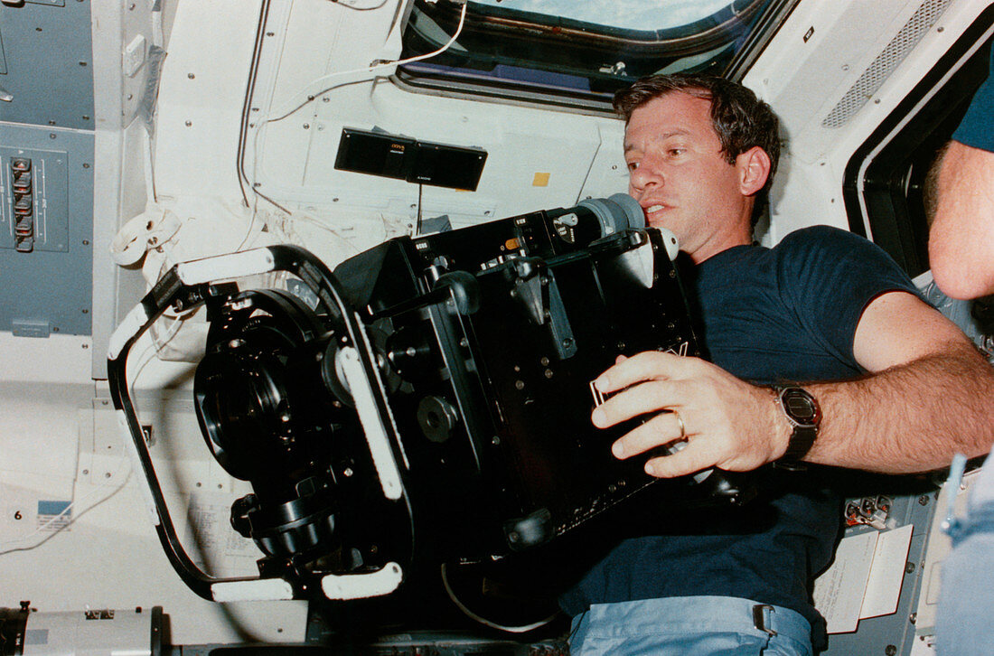 Shuttle astronaut holds IMAX cine camera