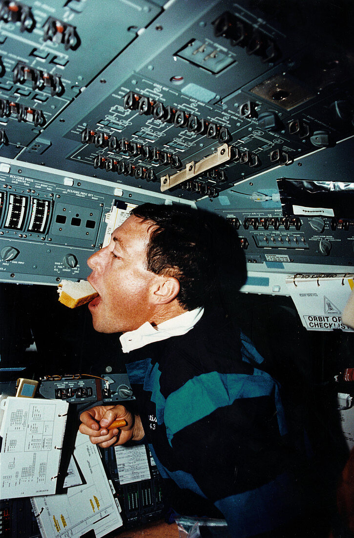 Astronaut Baker chasing a sandwich,Shuttle STS-43
