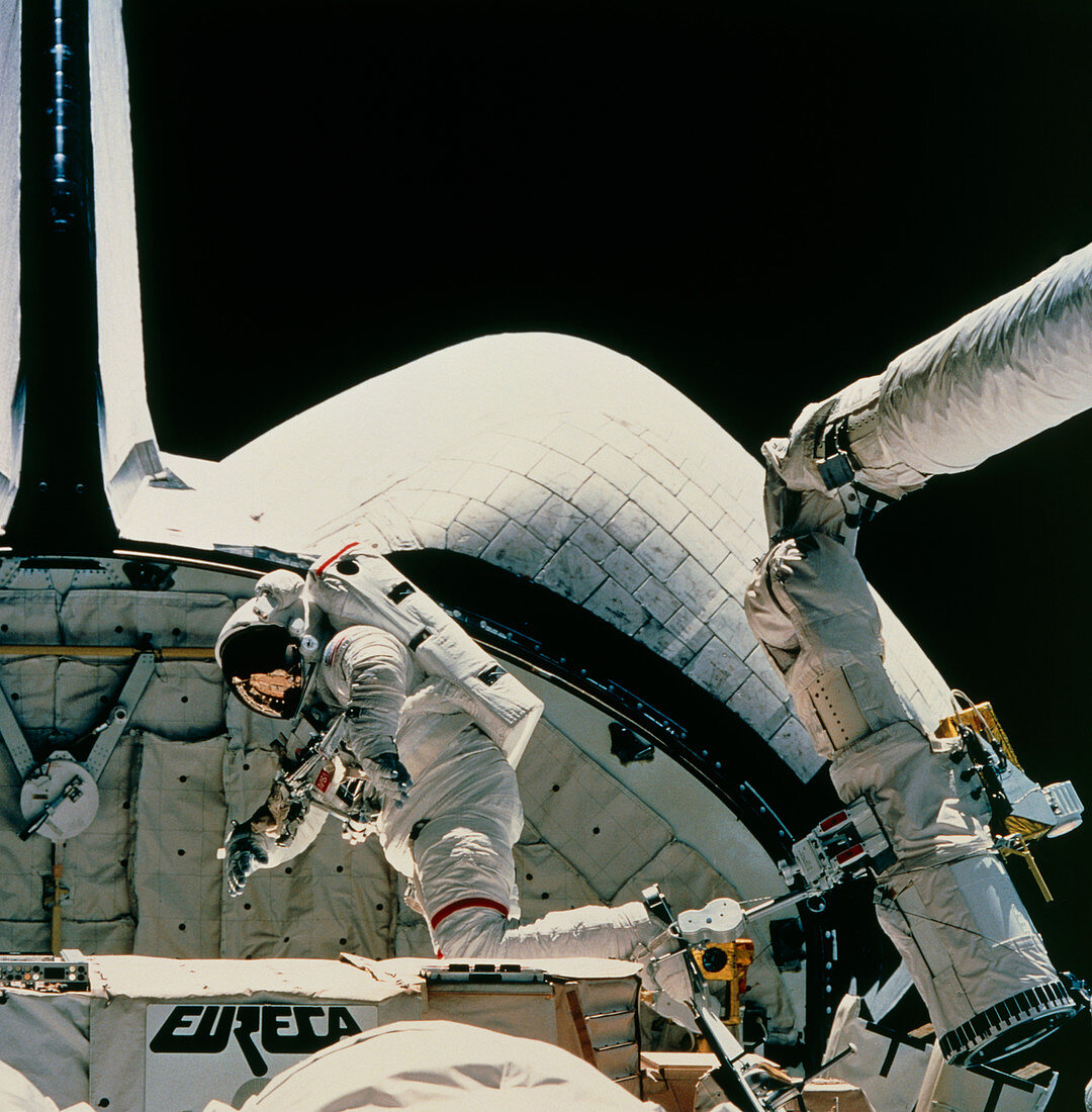 Astronaut Low on RMS arm,STS-57 EVA