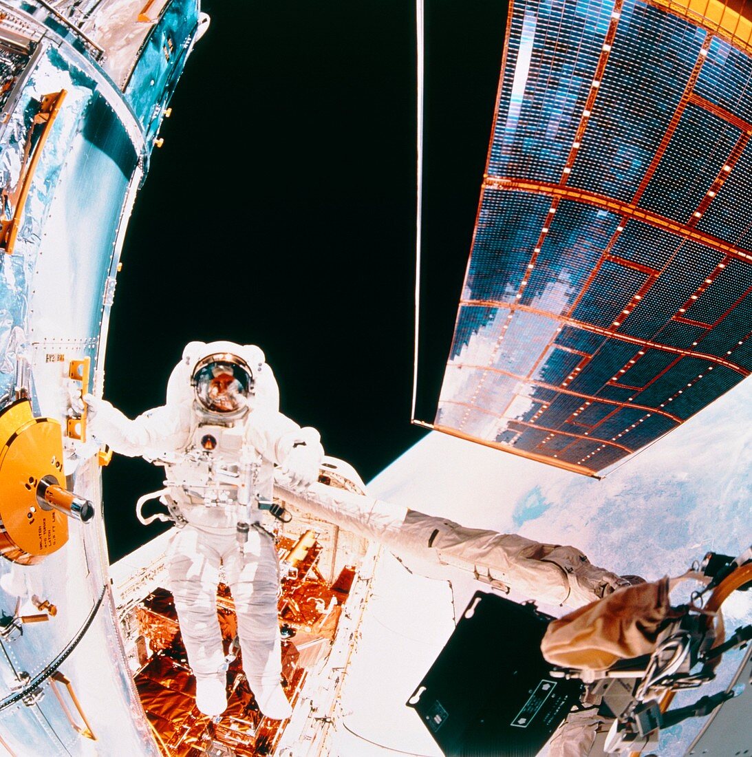 Fisheye view of HST and astronaut,Shuttle STS-61
