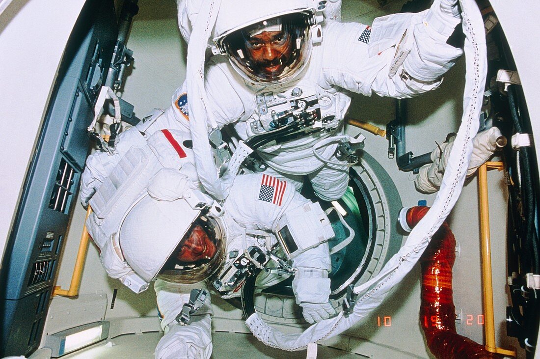 Shuttle astronauts in airlock prior to spacewalk