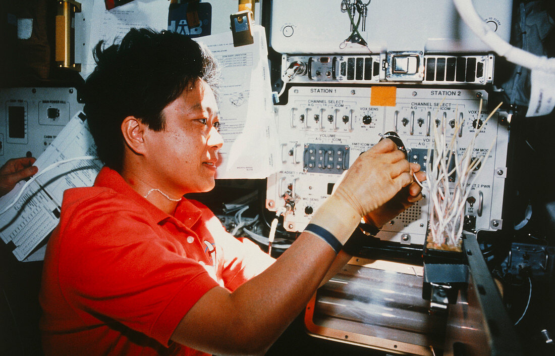 Payload specialist working on board STS-095