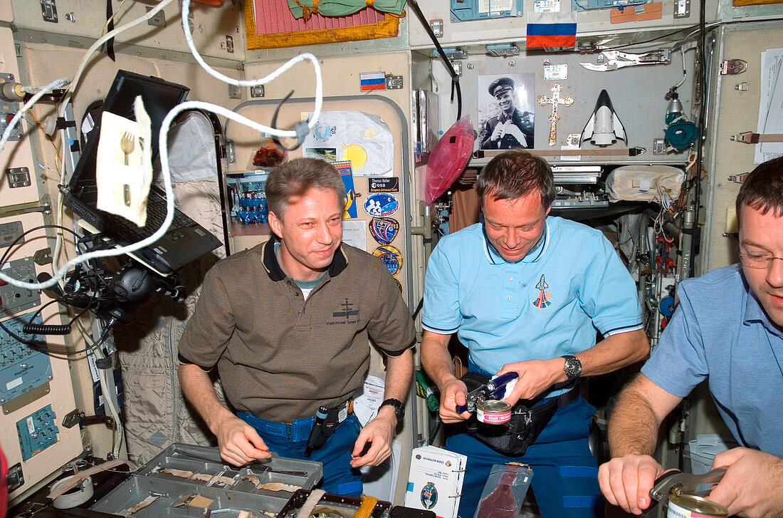 Astronauts eating during shuttle mission
