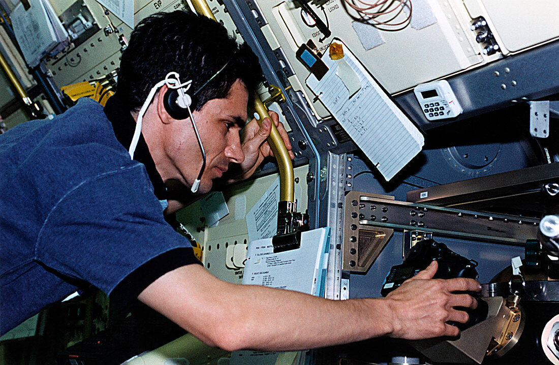 Astronaut experiments on board shuttle Spacelab
