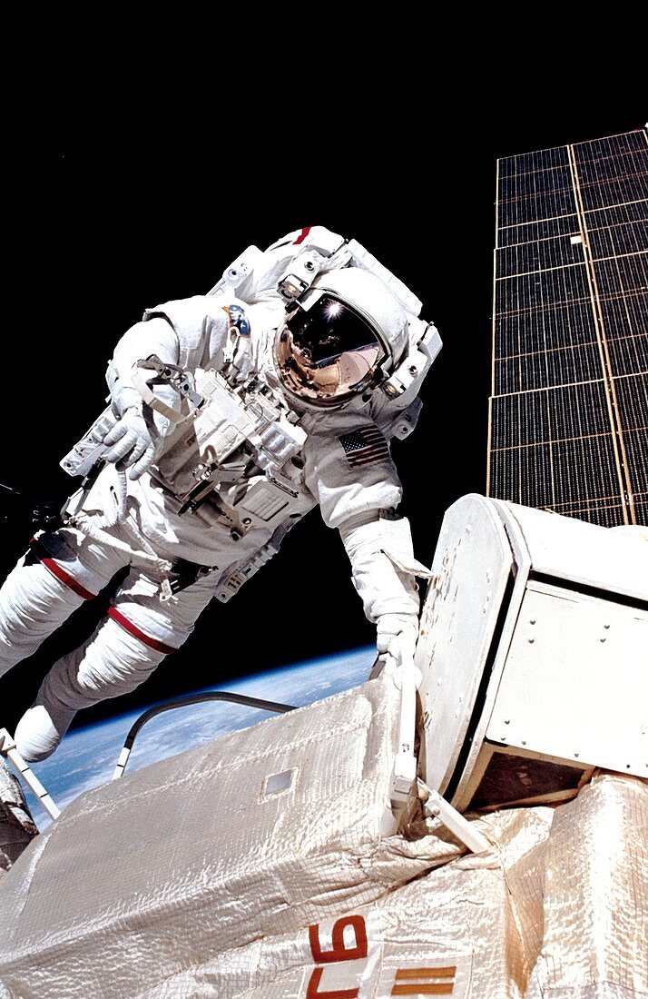 Astronaut J.H. Newman spacewalks on space station