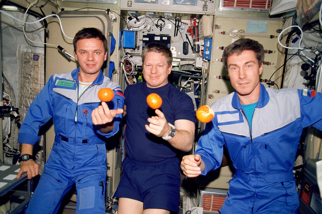 ISS astronauts about to eat oranges