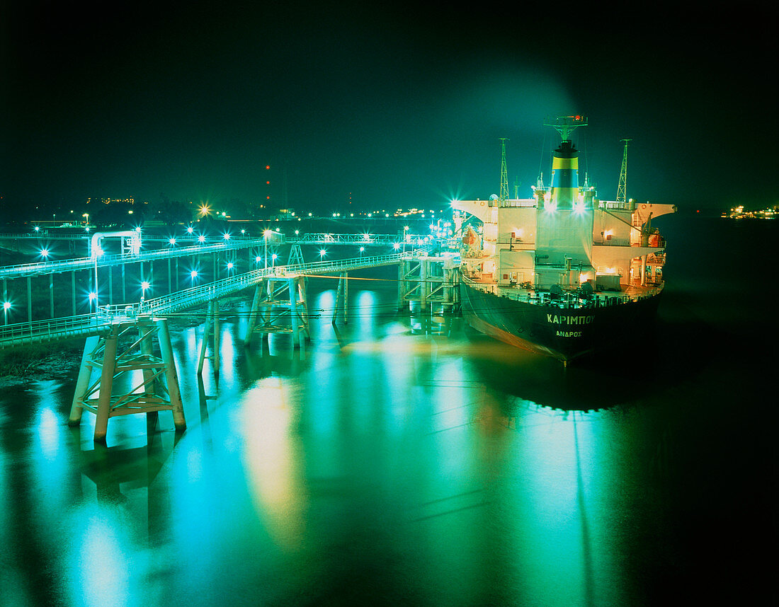 Oil tanker in port at night