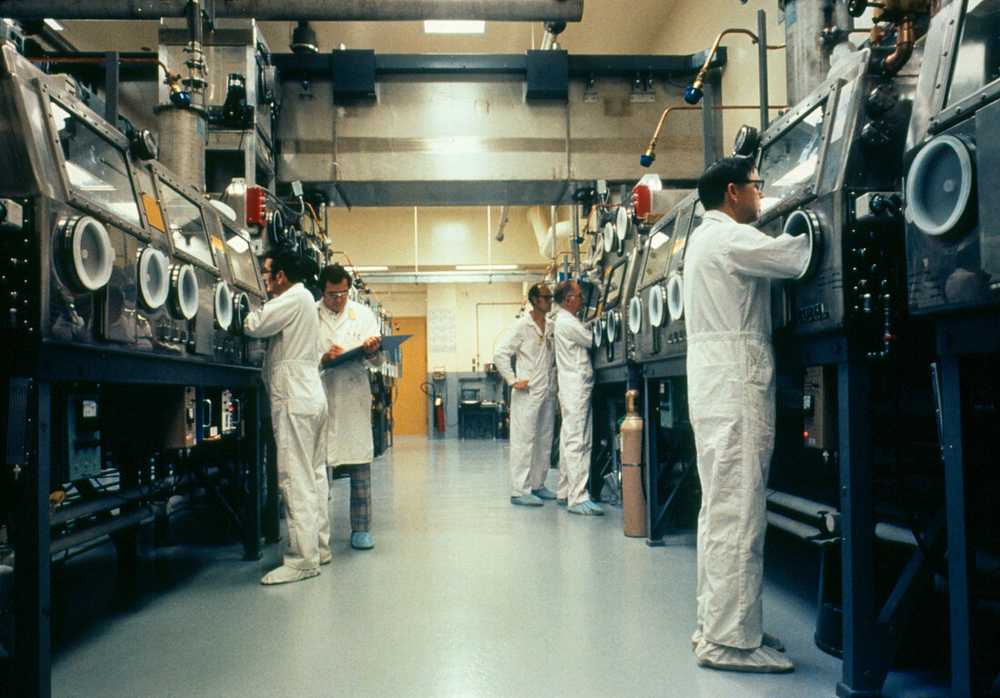 Workers using glovebox (radioactive compounds)