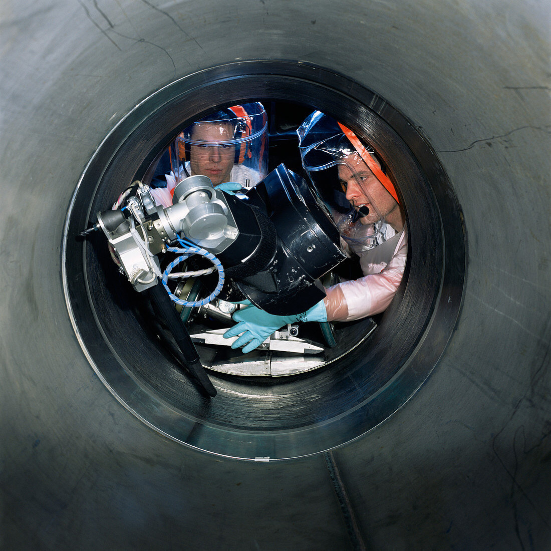 Nuclear technicians installing a robot