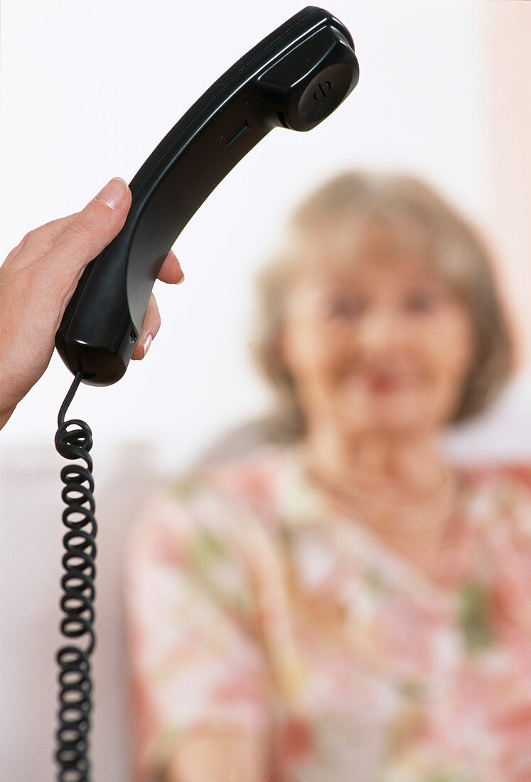 Hand holding a telephone