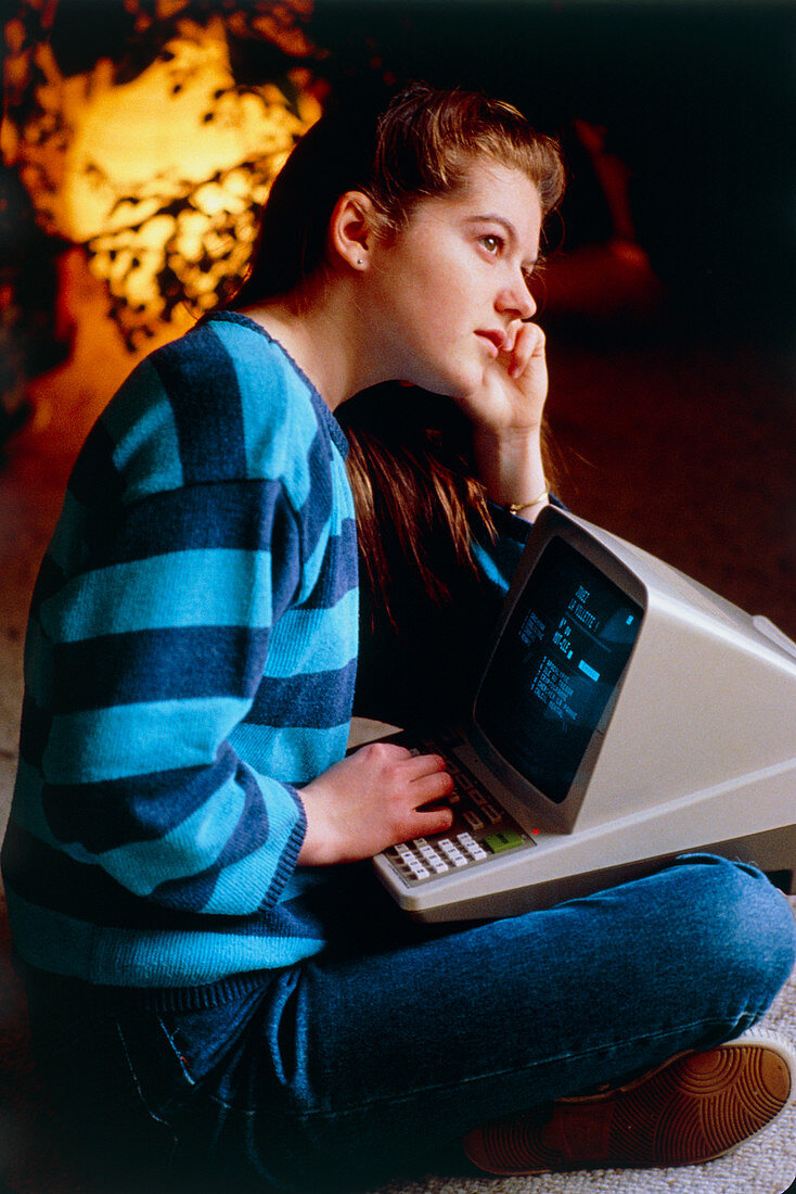 Teenager using Minitel computer directory